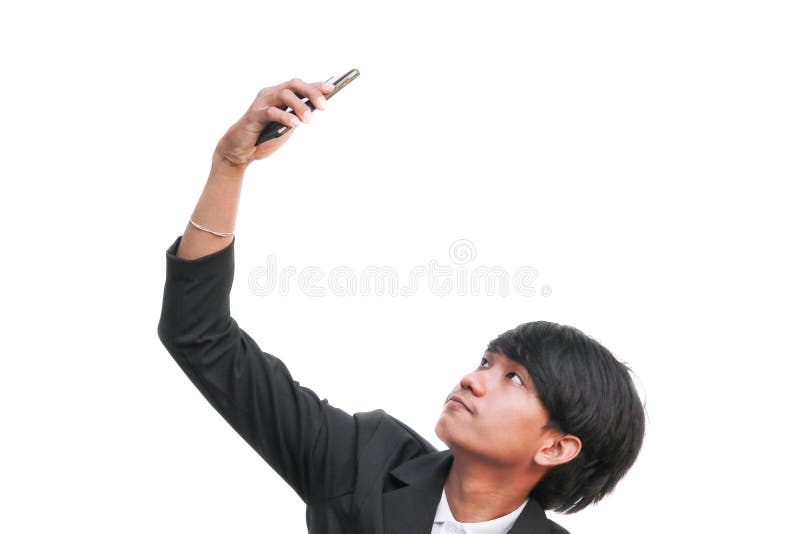 El hombre de negocios hermoso joven hace el selfie en el fondo blanco imagen de archivo El hombre de negocios hermoso joven hace el selfie en el fondo blanco imagen de archivo