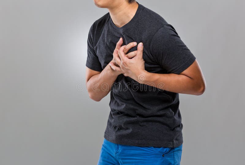 El hombre sufre de ataque del corazón foto de archivo