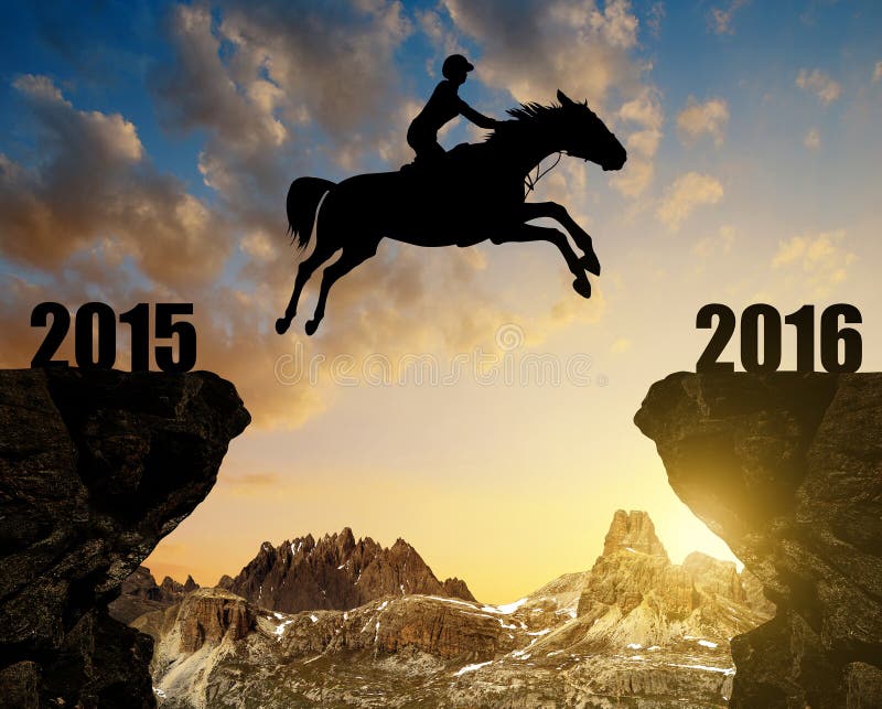 El jinete en el caballo que salta en el Año Nuevo 2016 imágenes de archivo libres de regalías El jinete en el caballo que salta en el Año Nuevo 2016 imágenes de archivo libres de regalías