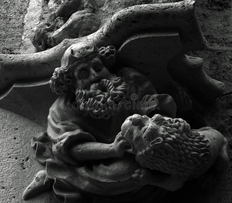 Shot in black and white on the sculpture on the facade of this historic building representing some characters / animals / plants. Set in Eixample, Barcelona, Catalunya, Spain, Europe. Shot in black and white on the sculpture on the facade of this historic building representing some characters / animals / plants. Set in Eixample, Barcelona, Catalunya, Spain, Europe