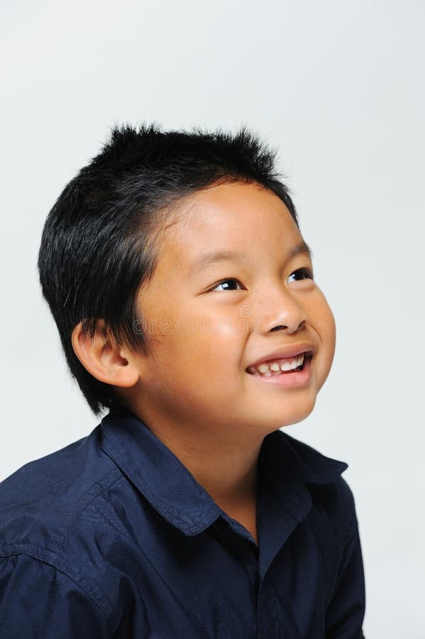 Asian boy looking up and smiling. Asian boy looking up and smiling