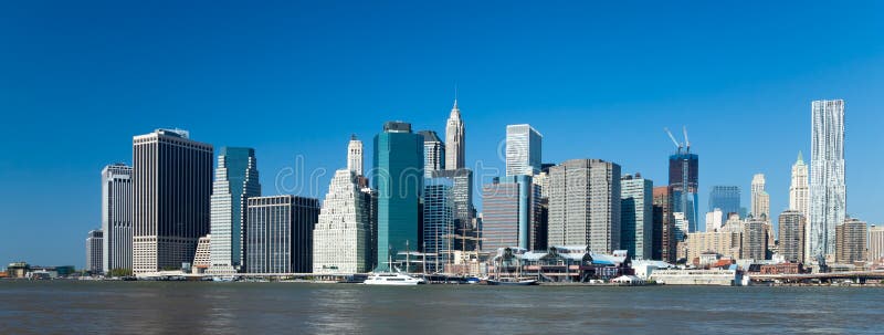 The New York City skyline at afternoon w the Freedom tower. The New York City skyline at afternoon w the Freedom tower