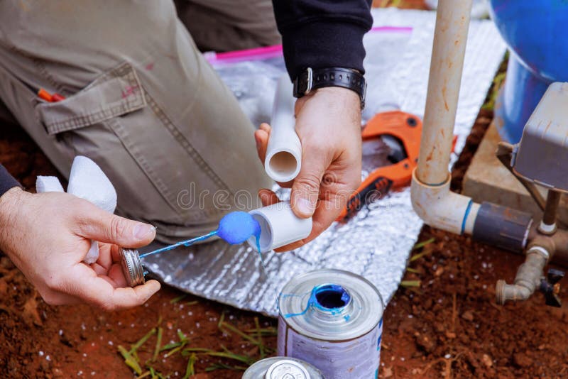 Glue is applied to pvc pipe before it is glued. Glue is applied to pvc pipe before it is glued