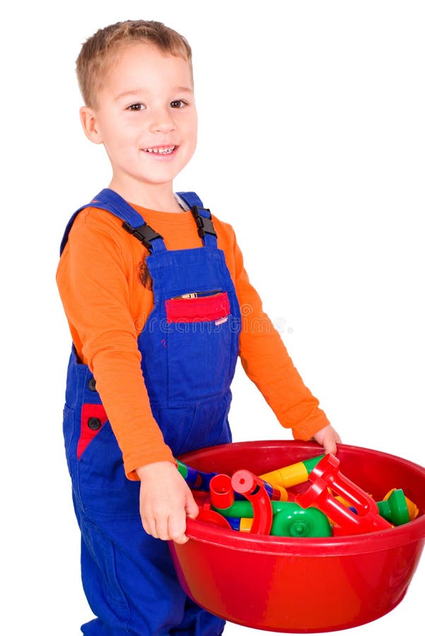 El pequeño niño está limpiando bloques imagen de archivo libre de regalías El pequeño niño está limpiando bloques imagen de archivo libre de regalías