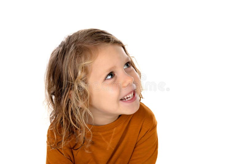 El pequeño niño rubio que se imaginaba algo aisló en un backgr blanco foto de archivo El pequeño niño rubio que se imaginaba algo aisló en un backgr blanco foto de archivo