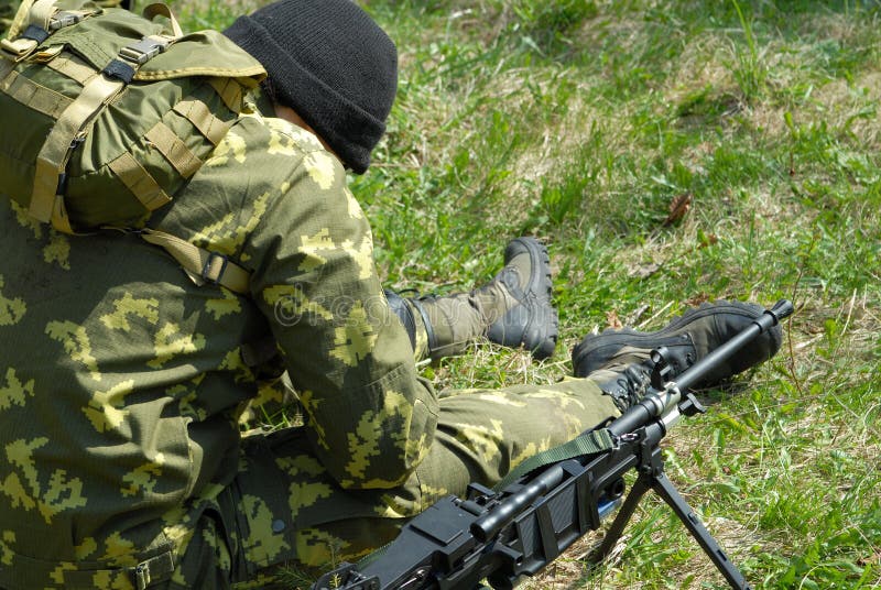 The soldier with the weapon during war. The soldier with the weapon during war