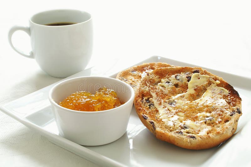 Toasted tea cakes with coffee and marmalade isolated on white background. Toasted tea cakes with coffee and marmalade isolated on white background