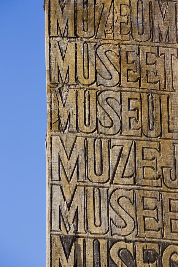 Aged and worn vintage wooden sign with the word museum engraved in various languages in the wood with blue sky. Quebrada de Humahuaca against a blue sky, Northern Argentina 2014. Aged and worn vintage wooden sign with the word museum engraved in various languages in the wood with blue sky. Quebrada de Humahuaca against a blue sky, Northern Argentina 2014
