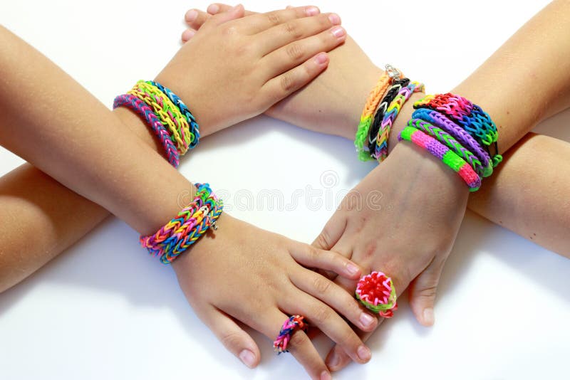Colorful rubber rainbow loom band bracelets on wrist, trendy kids