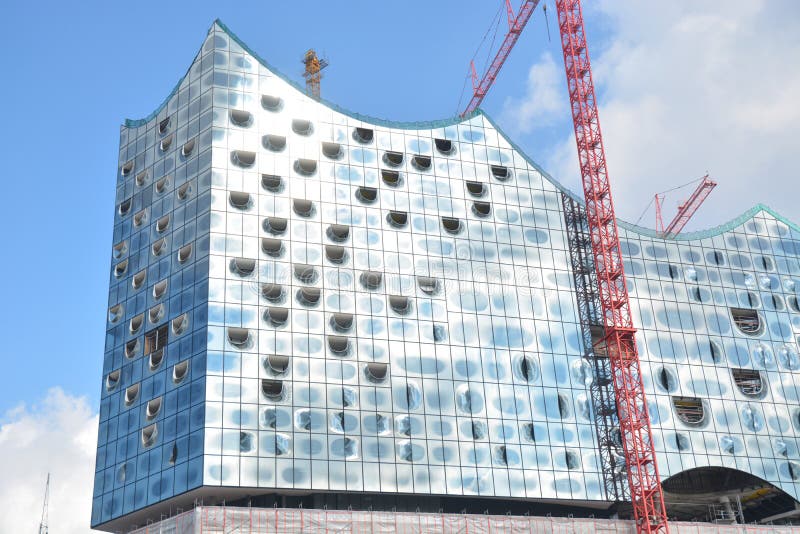 This is the beautiful Elbe Philharmonic Hall in Hamburg, Germany. Still under construction... located in HafenCity, a new part of Hamburg. Designed by Herzog & Meuron. It should open in 2017. It is constructed entirely of glass. No glass palte is alike another. All of them are unique. It will the highest inhabited building in Germany. This is the beautiful Elbe Philharmonic Hall in Hamburg, Germany. Still under construction... located in HafenCity, a new part of Hamburg. Designed by Herzog & Meuron. It should open in 2017. It is constructed entirely of glass. No glass palte is alike another. All of them are unique. It will the highest inhabited building in Germany.