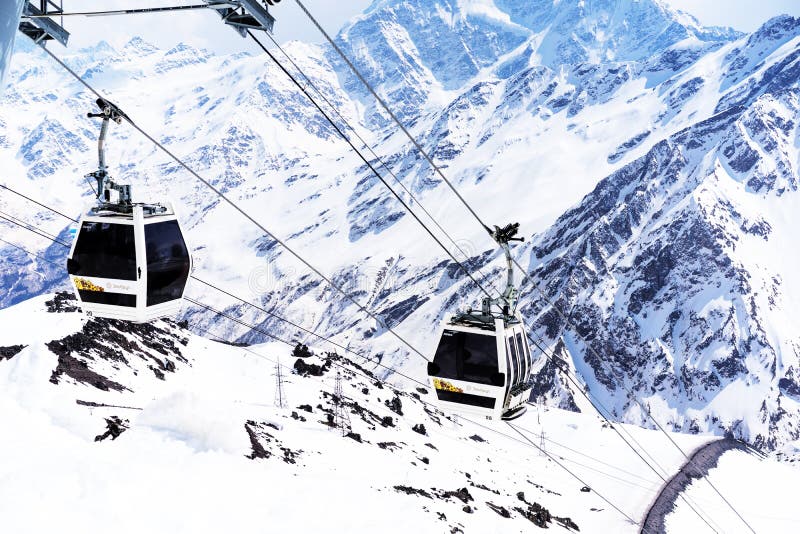 ELBRUS, RUSSIA - APRIL 12, 2018: Cable cars on a background of mountains in the ski resort of Elbrus, the Caucasus Mountains