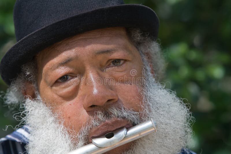 Elderly African American Man Playing Flute royalty free stock photo