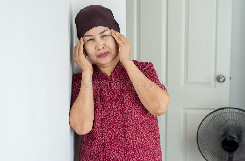 Elderly Asian woman depression of lonely have a headache at home,Mental disorder health care,World suicide prevention day concept stock photography Elderly Asian woman depression of lonely have a headache at home,Mental disorder health care,World suicide prevention day concept stock photography