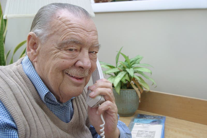 Elderly businessman on phone
