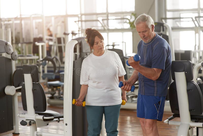 Elderly Couple Working Out At Gym Stock Photo Image Of Lift