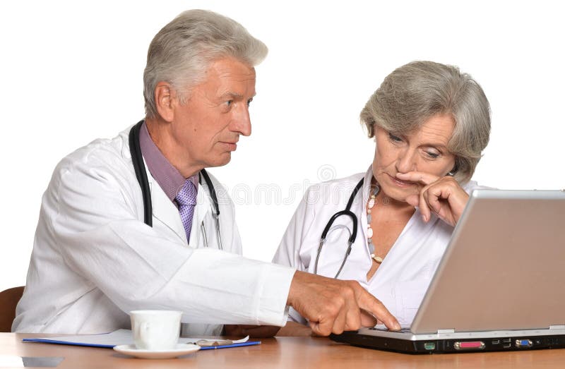 Elderly doctors with a laptop