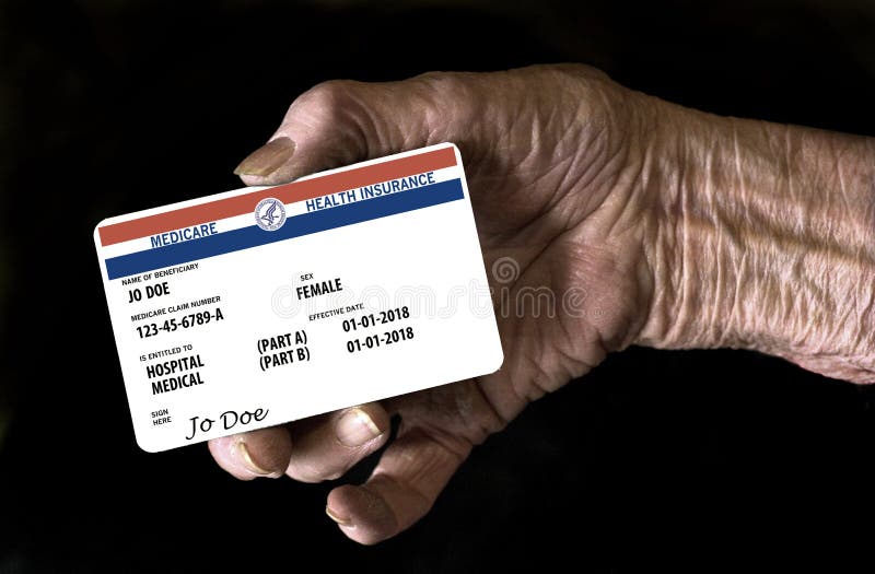 An elderly female hand holds a mock United State government Medicare Health Insurance card. It is a generic card. royalty free stock image An elderly female hand holds a mock United State government Medicare Health Insurance card. It is a generic card. royalty free stock image