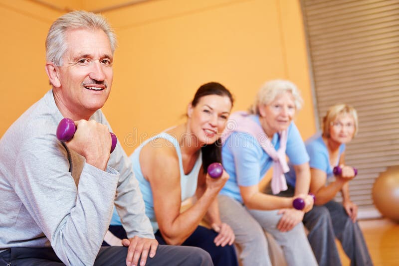 Elderly group with dumbbells in fitness center royalty free stock photos Elderly group with dumbbells in fitness center royalty free stock photos