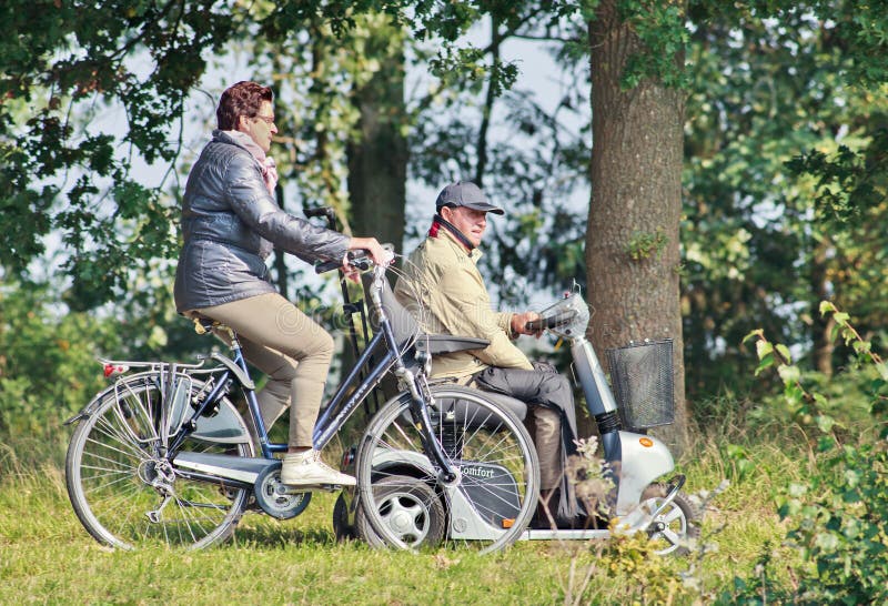 Elderly having a ride in a forrest, Tilburg, Netherlands