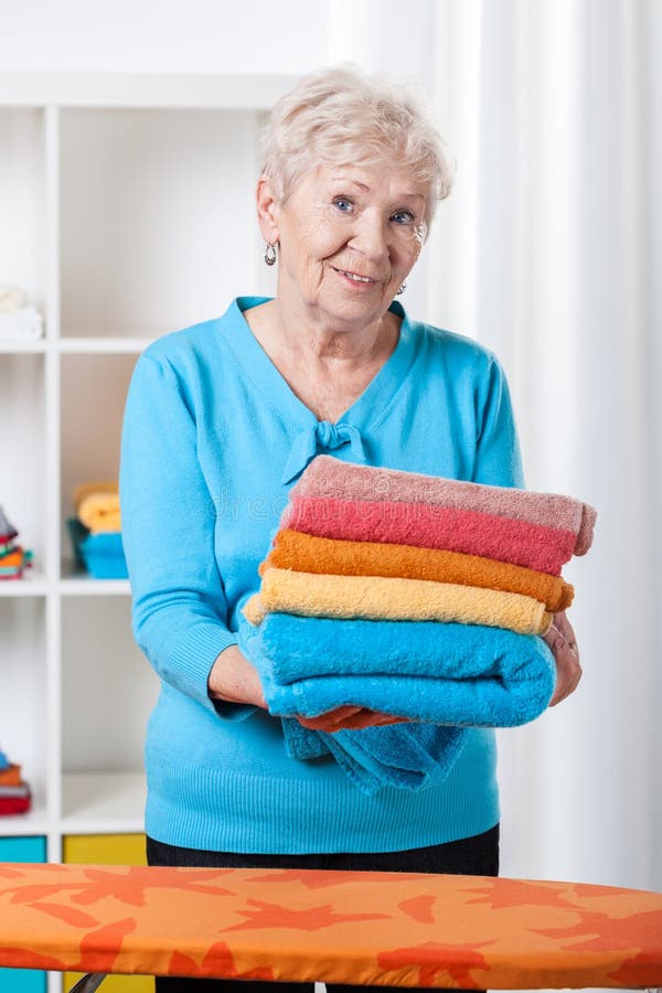 Elderly Lady Folding Towels Stock Photo Image of helping, chore 38383138