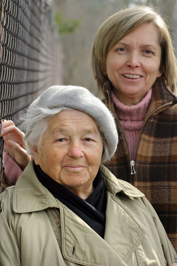 Mother and daughter. Focus on the first (older) woman. Old granny stock images, royalty-free photos and pictures