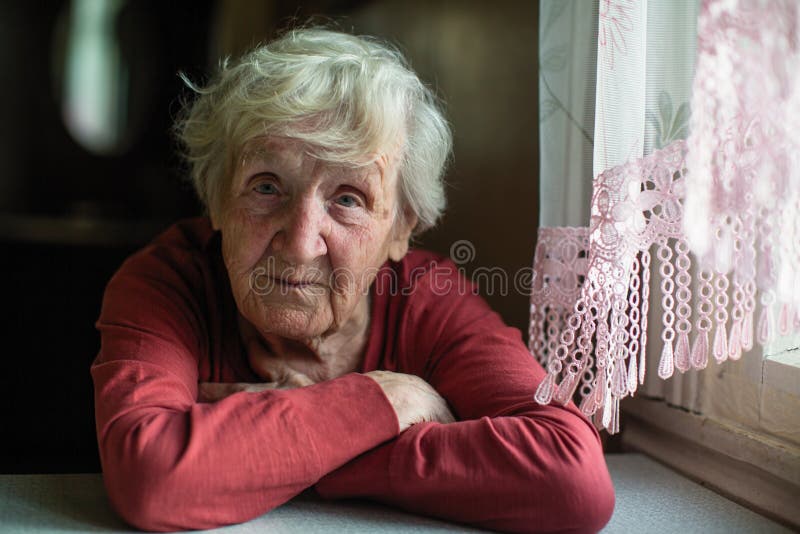 Portrait of Elderly Lady Sitting at the Table. Stock Image Image of