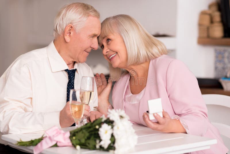 Elderly love birds enjoying emotional moment