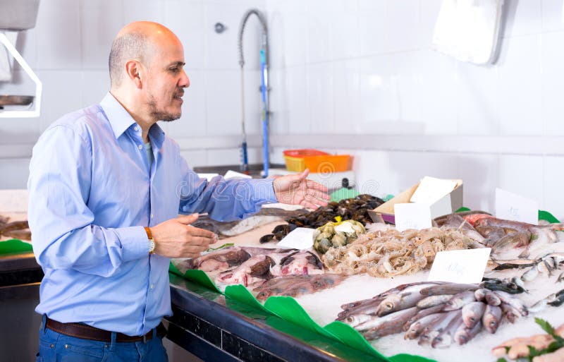 Elderly Man Choosing Cooled Seafood in Fish Stock Image Image of