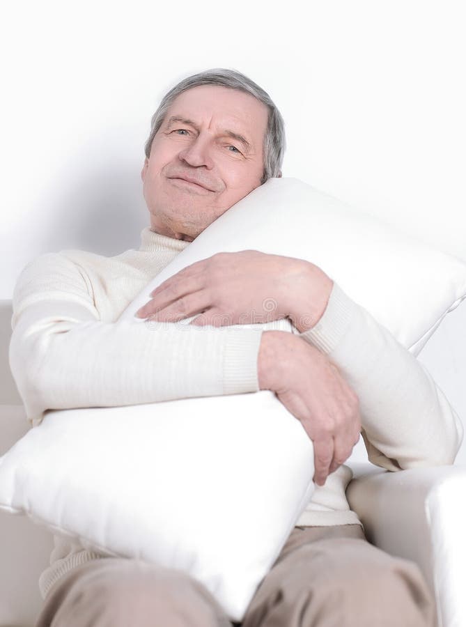 Elderly Man with a Comfortable Pillow.isolated on White Stock Image