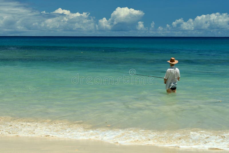 Elderly man fishing in the sea