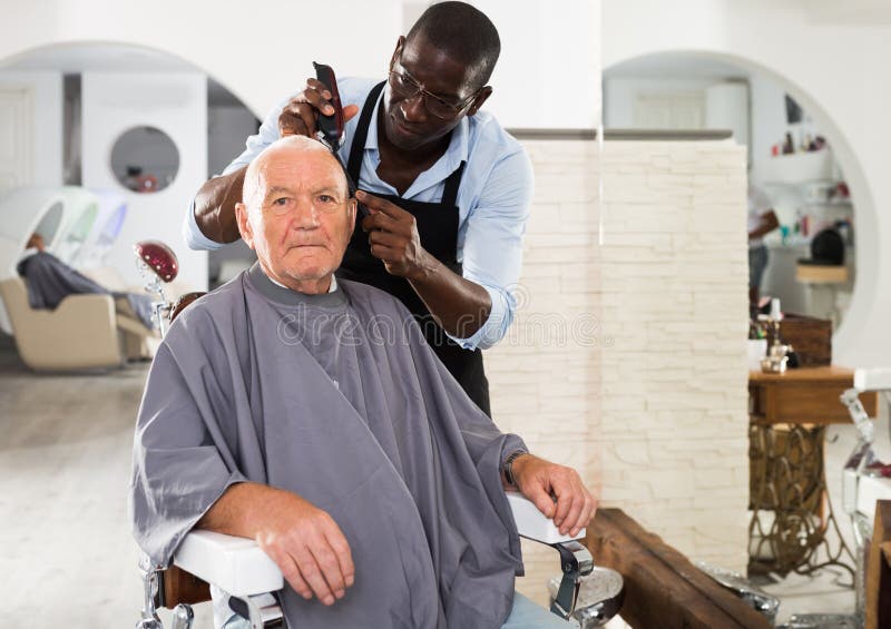 A Barber is Going through the Electric Cutting and Shaving Machine for the  Beard of an African-American Brazilian Boy Stock Image - Image of beauty,  business: 214303807