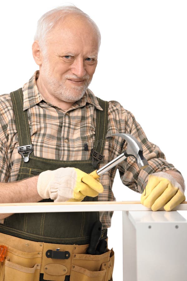 Elderly man hammering