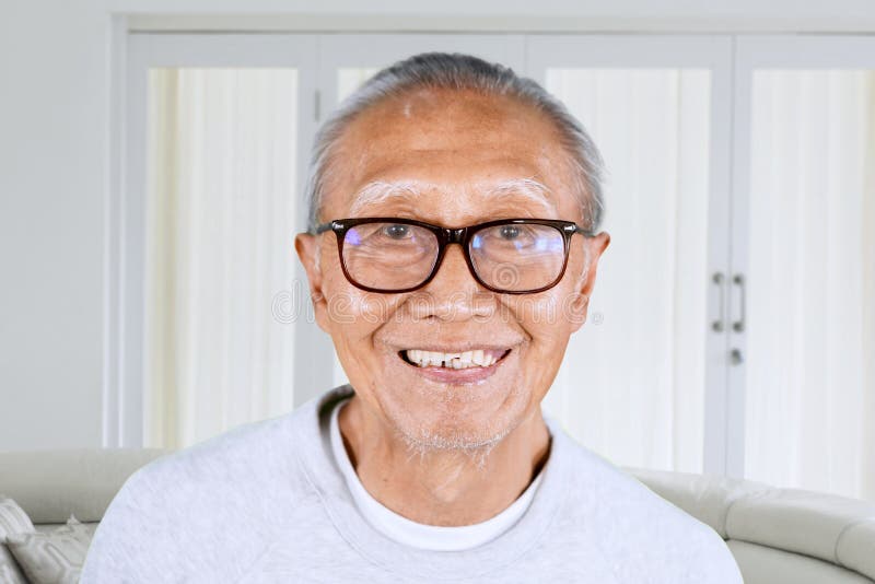 Elderly man with happy expression face at home royalty free stock photography Elderly man with happy expression face at home royalty free stock photography