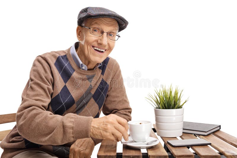 Elderly Man Sitting at a Coffee Table and Smiling Stock Image Image