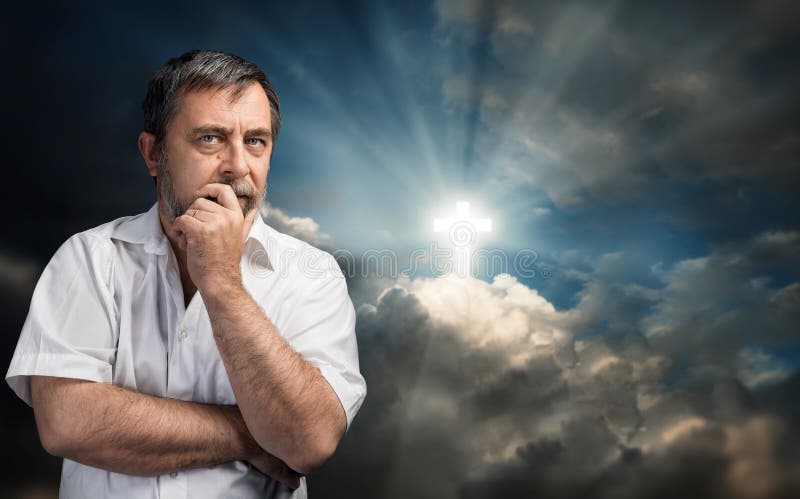 Elderly man thinking about faith and God