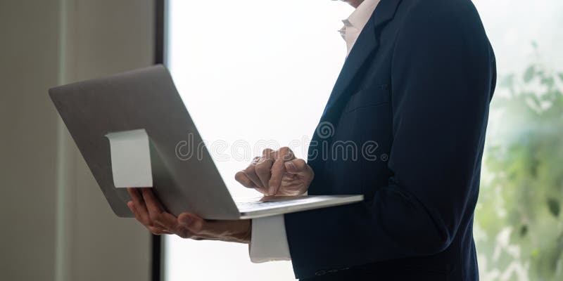 Elderly professional using laptop for business insights and digital strategy. royalty free stock photography
