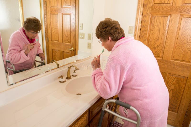 Elderly Senior Woman Brushing Teeth royalty free stock images Elderly Senior Woman Brushing Teeth royalty free stock images