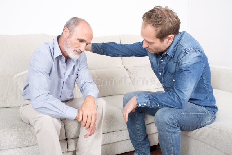 Elderly son comforting father royalty free stock photos Elderly son comforting father royalty free stock photos