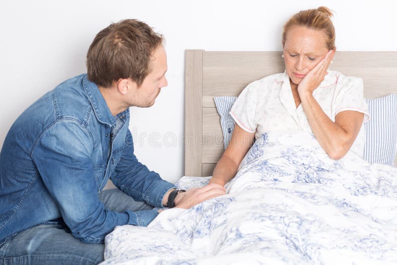 Elderly Son Takes Care Of Ill Mother In Bed Stock Image Image Of