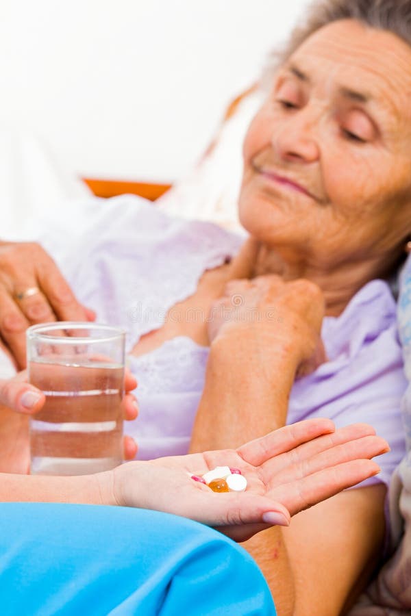 Elderly Taking Pills stock photo