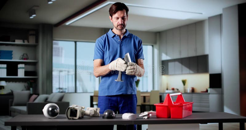 Elderly Technician Installing Surveillance Camera For Building Security And Safety. Old cctv monitor stock images, royalty-free photos and pictures