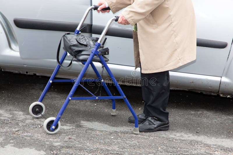 Elderly Woman with a Blue Walker on Street Stock Image Image of help