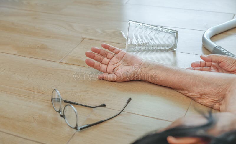 Elderly woman falling down at home ,hearth attack. Close up elderly woman falling down at home ,hearth attack stock images