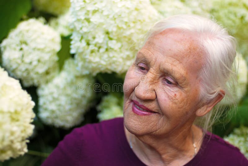 Elderly woman in garden