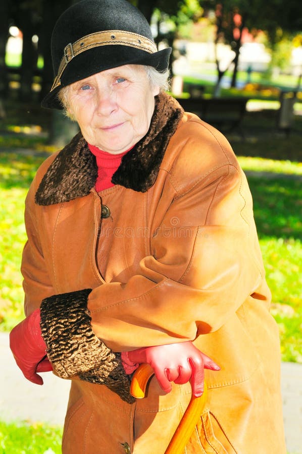 Elderly woman in park stock photos Elderly woman in park stock photos