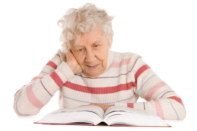 The elderly woman reads the book