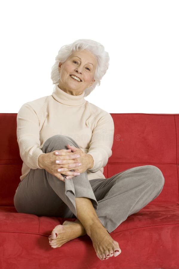 Elderly woman relaxing on the couch