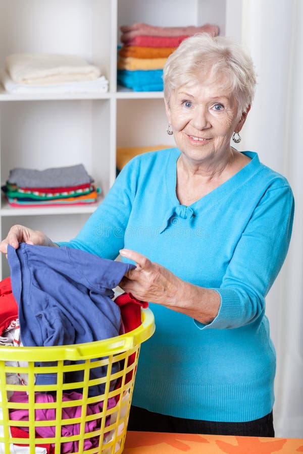 Elderly Woman Sorting Laundry Stock Image Image of help, elder 40332889
