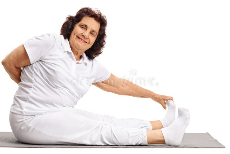Elderly woman stretching on an exercise mat royalty free stock photos Elderly woman stretching on an exercise mat royalty free stock photos