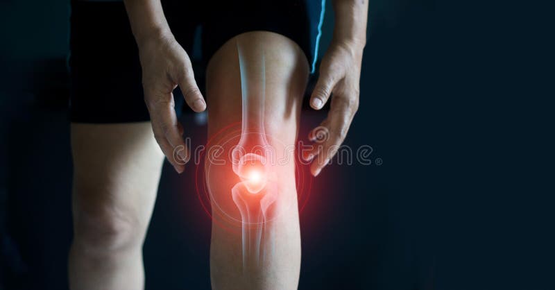 Elderly woman suffering from pain in knee. Tendon problems and Joint inflammation on dark background. stock image Elderly woman suffering from pain in knee. Tendon problems and Joint inflammation on dark background. stock image
